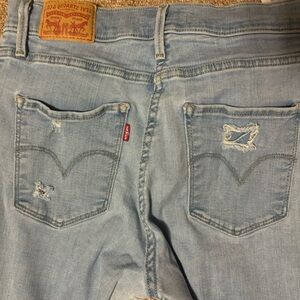 Lev’s 729 High Waisted Super Skinny Light Blue Distressed Denim Jeans